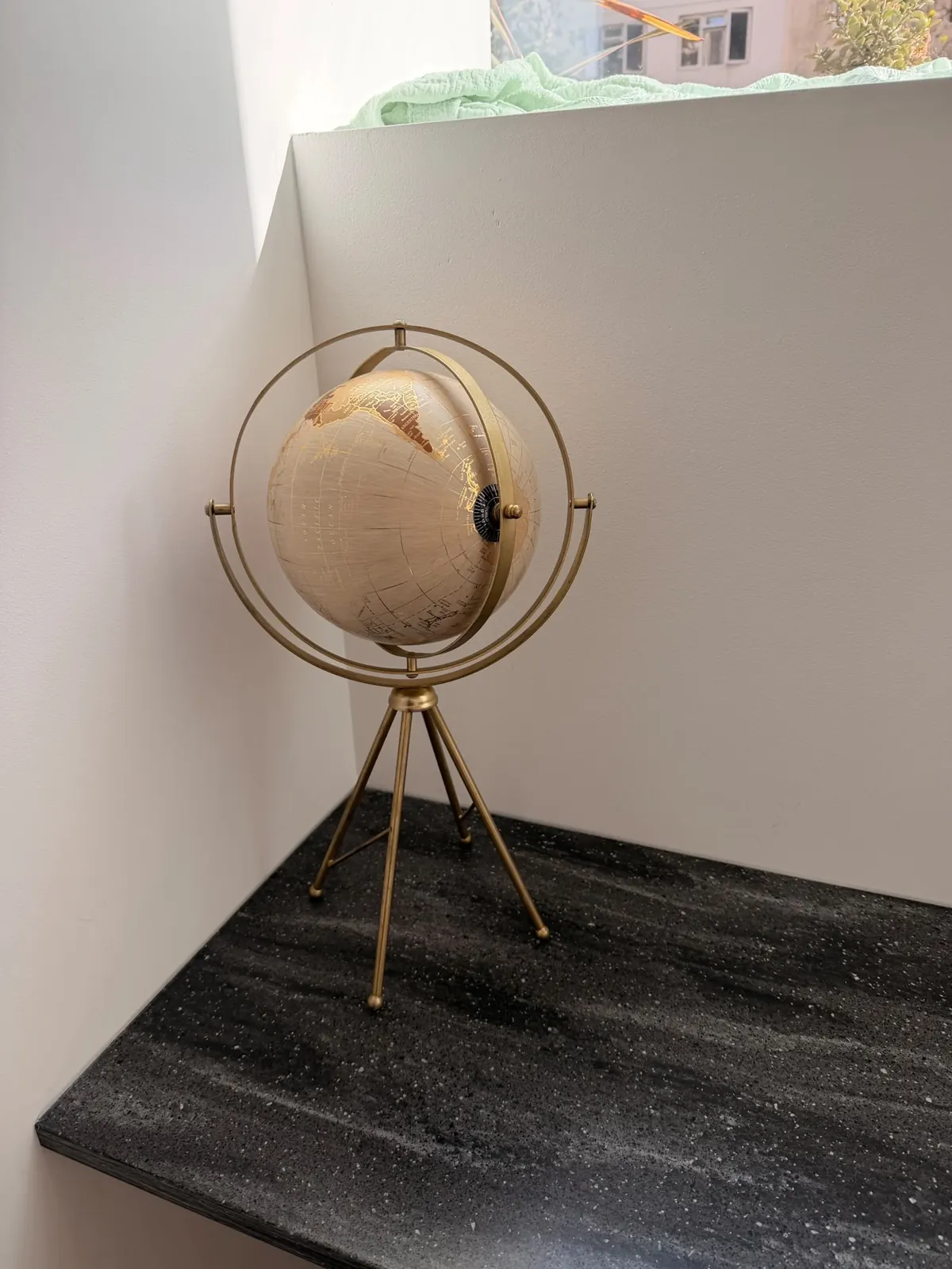 A brass globe lamp in the studio